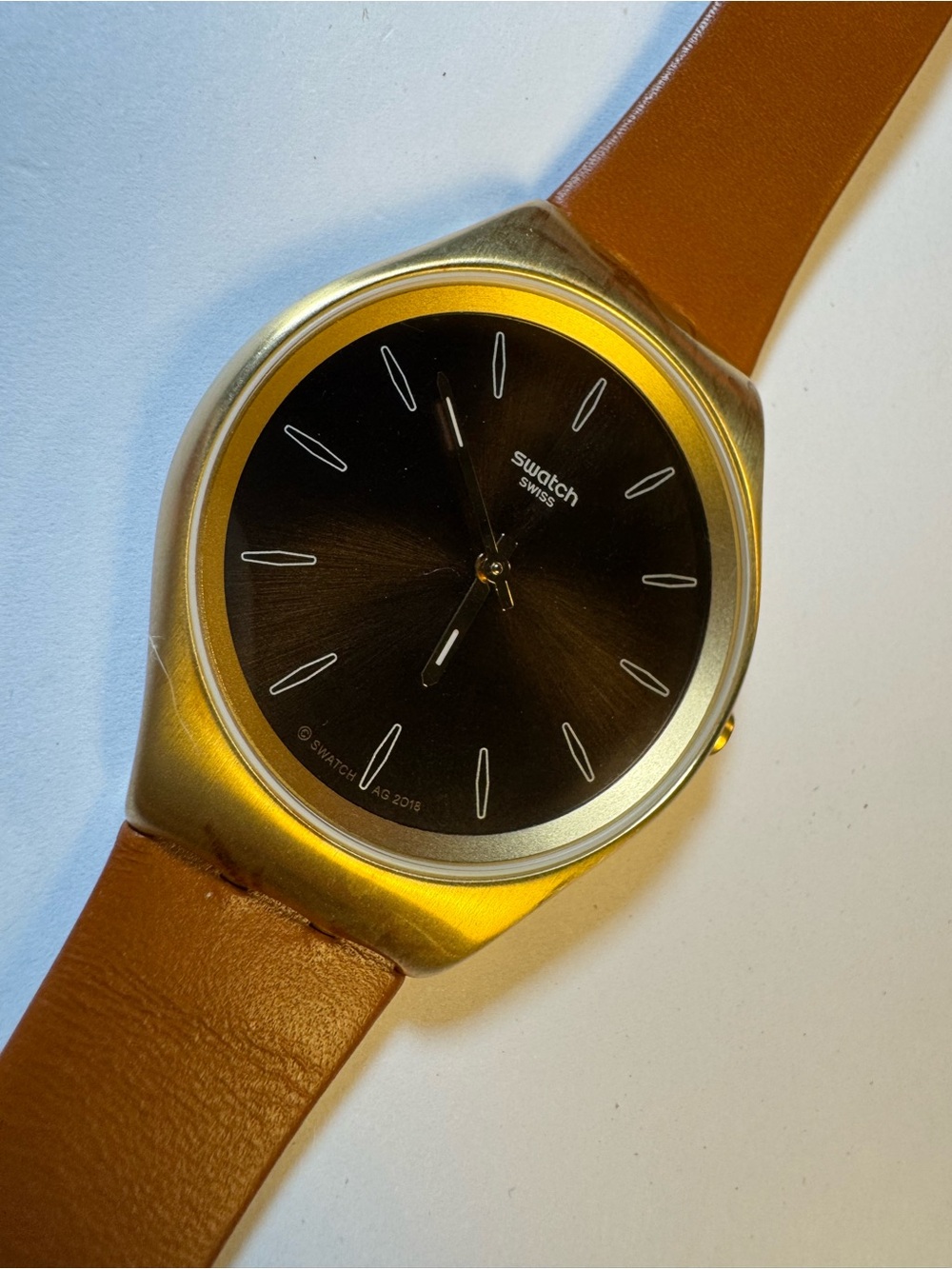 Swatch Skinsand SYXG104 gold-tone and leather analog watch
